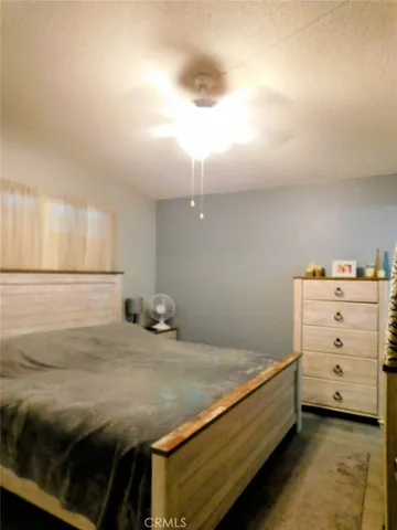 a bedroom with a bed and a cabinets