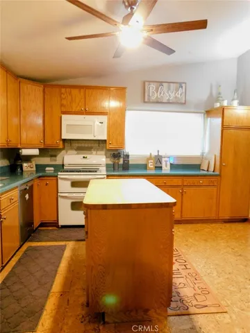 a kitchen with a sink appliances and cabinets