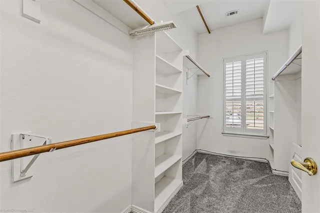 a bathroom with a sink a mirror and a shower