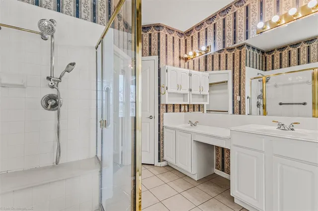 a bathroom with a bathtub and a shower