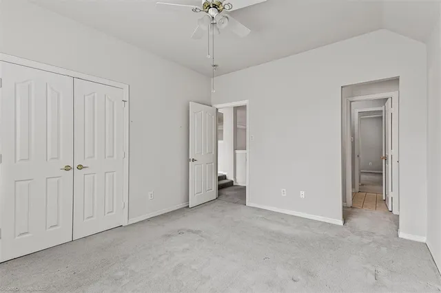 a bathroom with a toilet a sink and a mirror