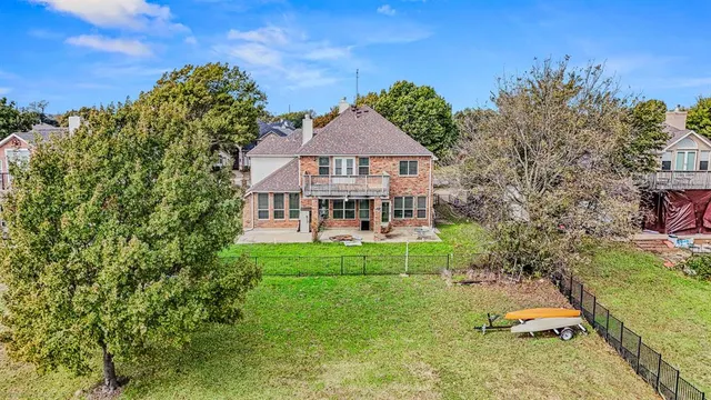 a view of a chairs and table in the patio with a fire pit