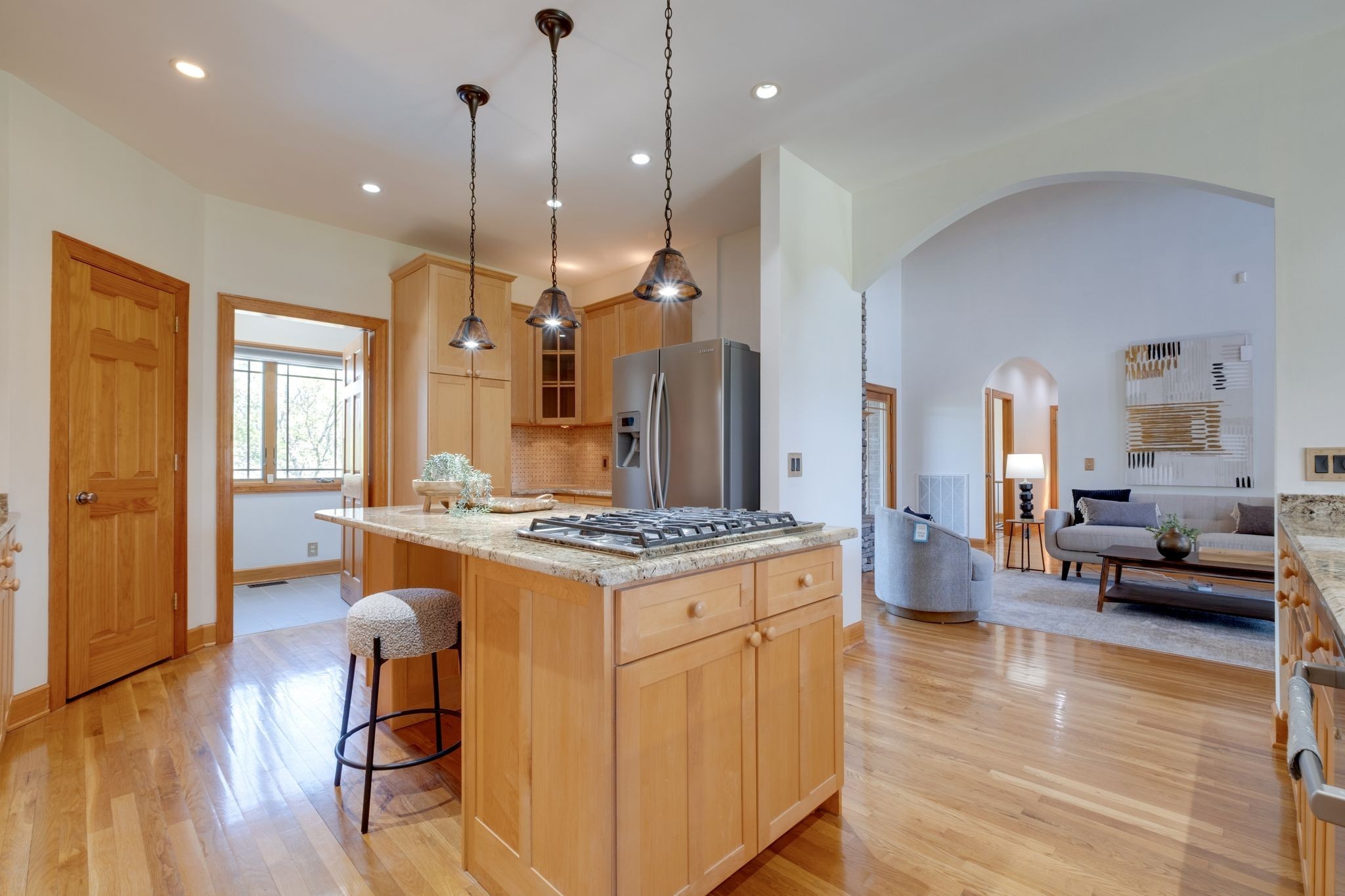 1249 White Road Bon Aqua, TN 37025 - Photo 12 of 60 a large kitchen with stainless steel appliances granite countertop a stove and a wooden floors