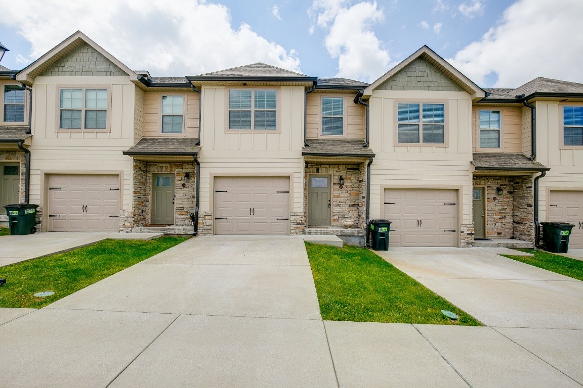 272 Signature Place Lebanon, TN 37087 - Photo 1 of 36 a front view of a house with a yard and garage