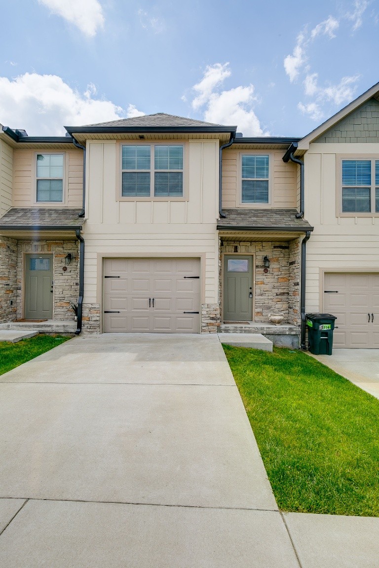 272 Signature Place Lebanon, TN 37087 - Photo 2 of 36 front view of a house with a yard