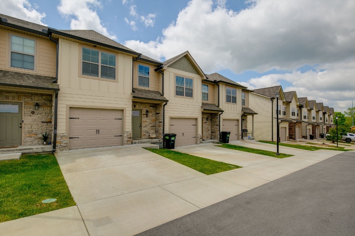 272 Signature Place Lebanon, TN 37087 - Photo 4 of 36 a view of a white house with a large space in front of it
