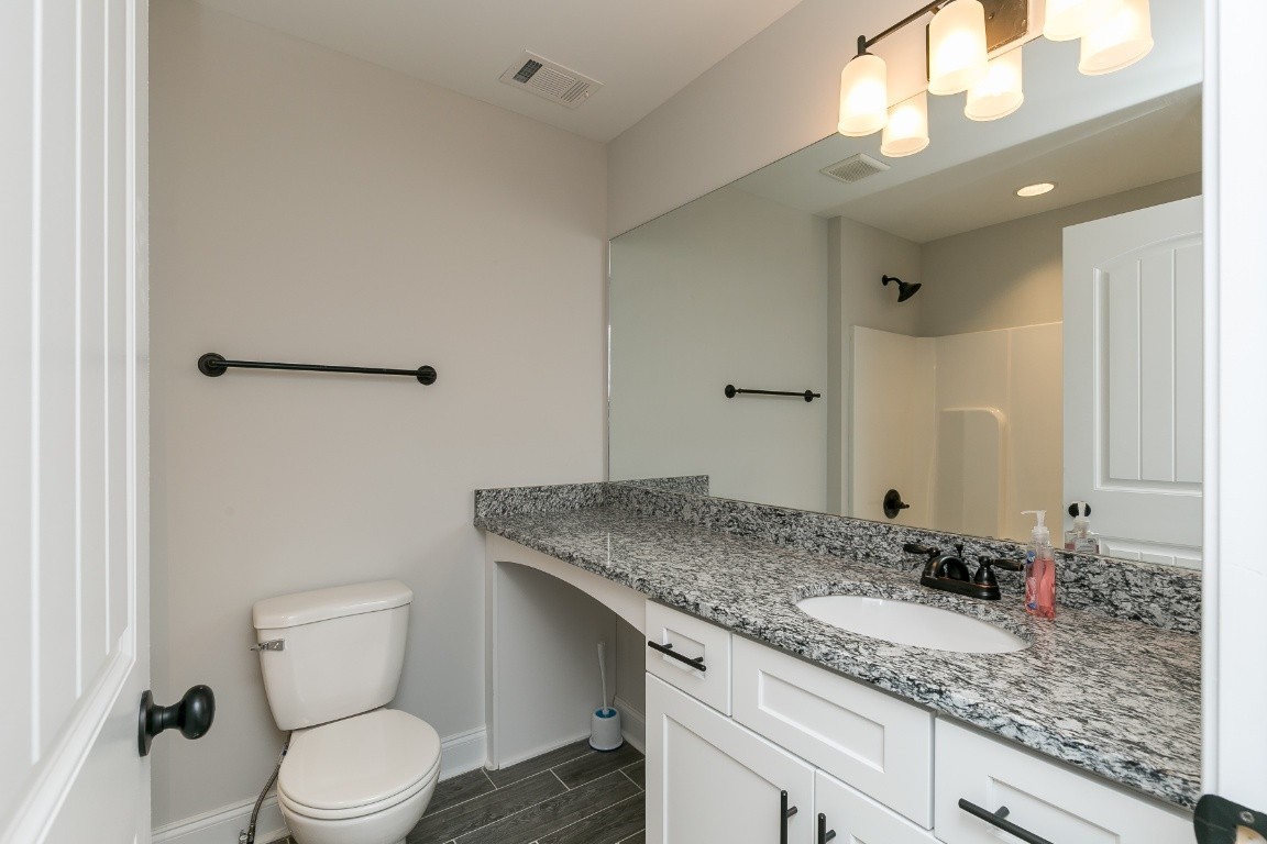 272 Signature Place Lebanon, TN 37087 - Photo 31 of 36 a bathroom with a granite countertop sink and a mirror