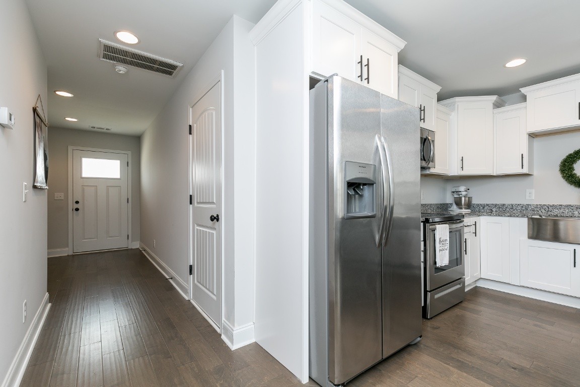 272 Signature Place Lebanon, TN 37087 - Photo 6 of 36 a kitchen with stainless steel appliances granite countertop a refrigerator and a stove top oven