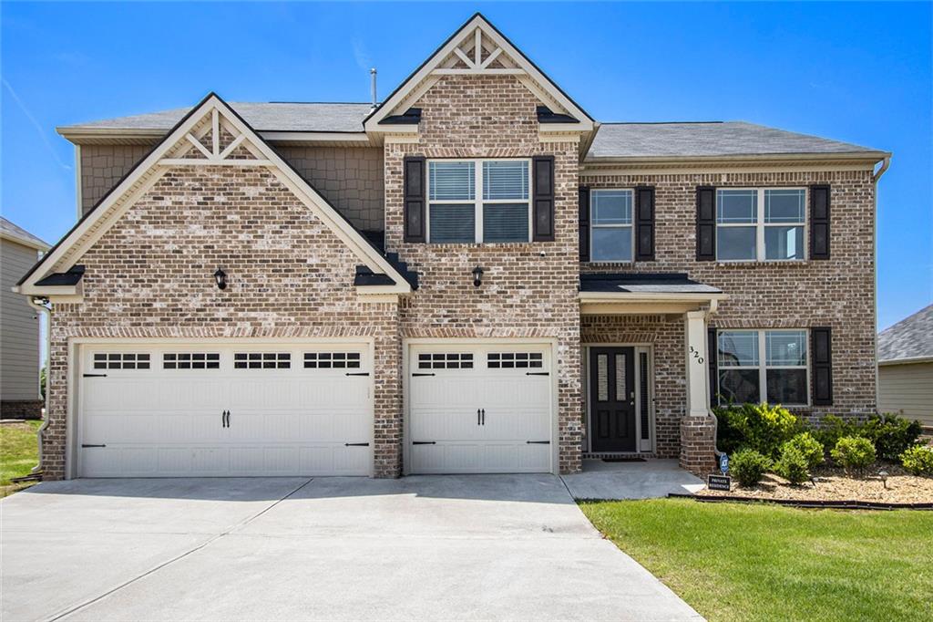 320 Conley Avenue Hampton, GA 30228 - Photo 1 of 1 a view of a white house with a yard and a large tree