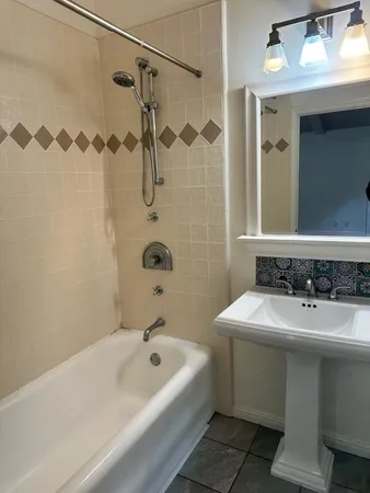 a bathroom with a sink and a bathtub