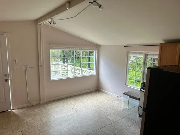 a kitchen with stainless steel appliances granite countertop a refrigerator sink and stove