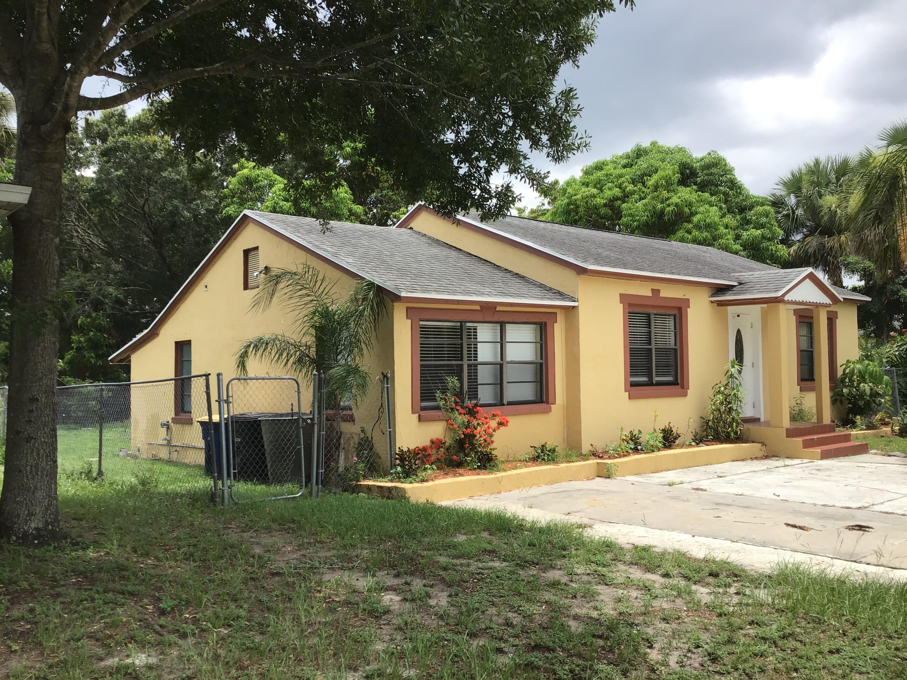1116 Colonial Road Fort Pierce, FL 34950 - Photo 1 of 19 a view of a house with a yard