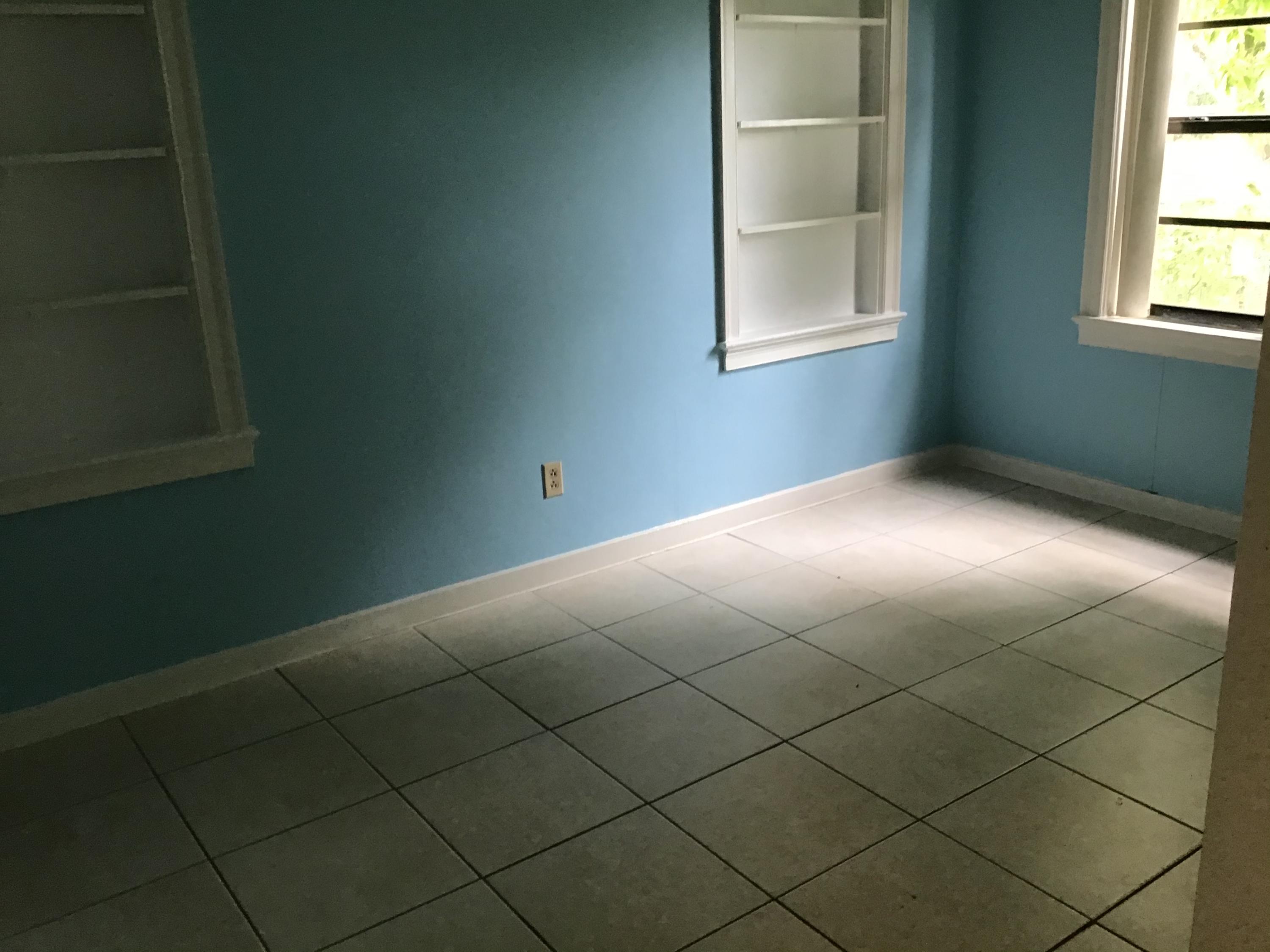 1116 Colonial Road Fort Pierce, FL 34950 - Photo 8 of 19 an empty room with a window