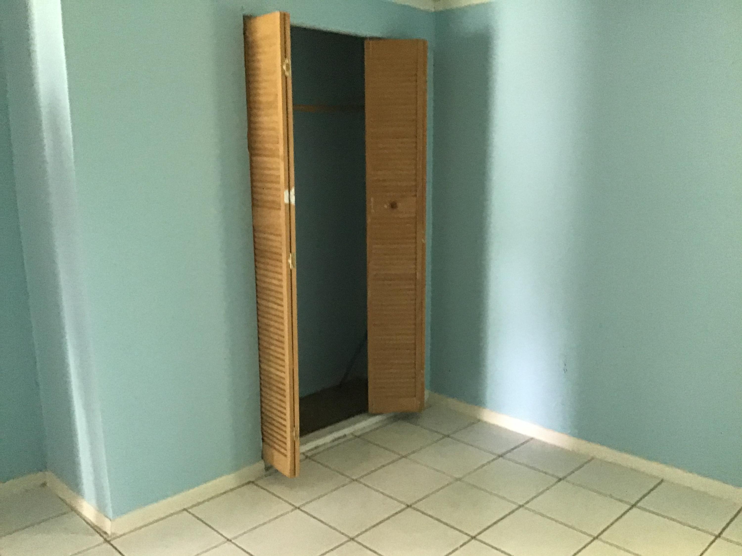 1116 Colonial Road Fort Pierce, FL 34950 - Photo 9 of 19 an empty room with windows