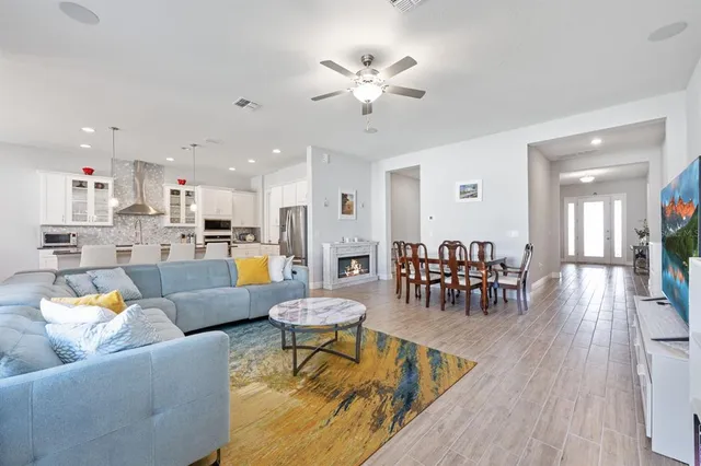 a bathroom with a granite countertop sink a mirror and a shower