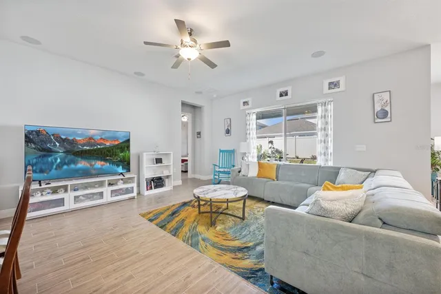 a bathroom with a granite countertop sink a large mirror and a bathtub