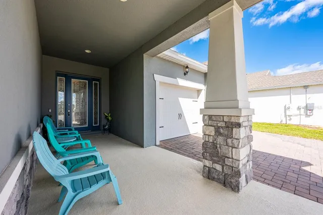 a large kitchen with stainless steel appliances granite countertop a lot of counter space and wooden floors
