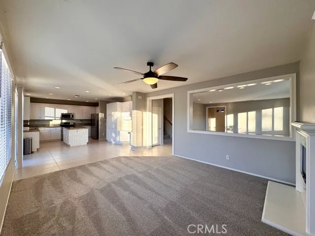 a kitchen with stainless steel appliances granite countertop a refrigerator oven a sink a stove and a refrigerator