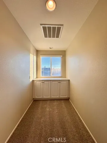 a spacious bathroom with a double vanity sink and a mirror