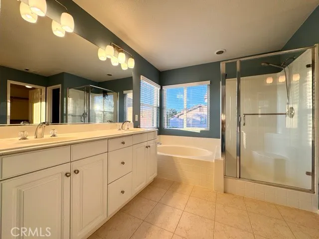 a view of a bathroom with a sink and a mirror