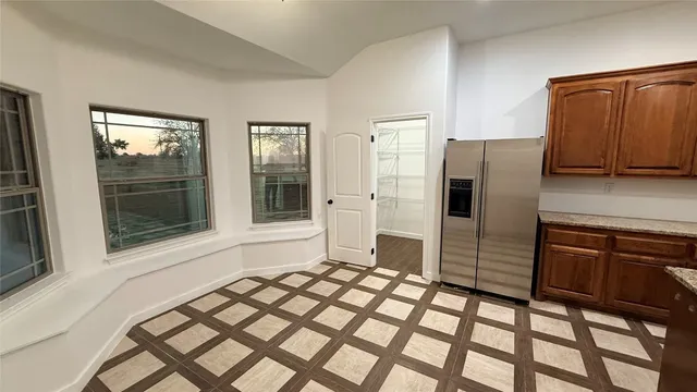 wooden floor in a hall with an entryway