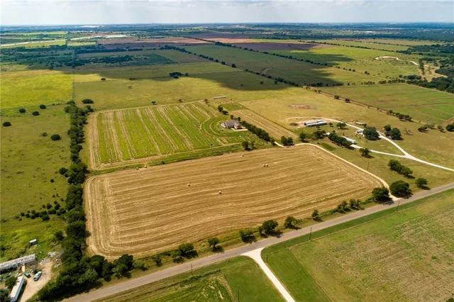 a view of a swimming pool and an outdoor seating