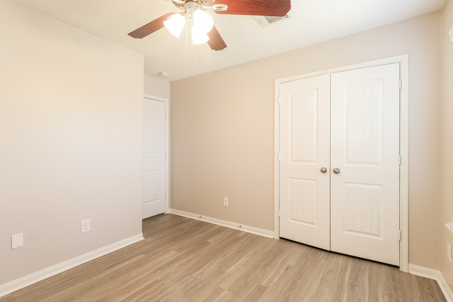 603 Lake View Drive Montgomery, TX 77356 - Photo 13 of 16 a view of an empty room with wooden floor
