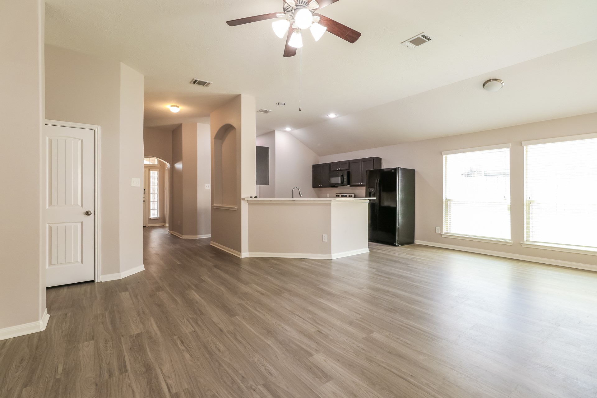 603 Lake View Drive Montgomery, TX 77356 - Photo 5 of 16 a view of a kitchen with a stove cabinets and wooden floor