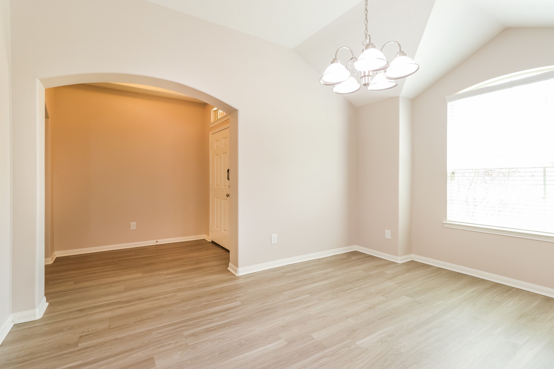603 Lake View Drive Montgomery, TX 77356 - Photo 6 of 16 an empty room with wooden floor and a window