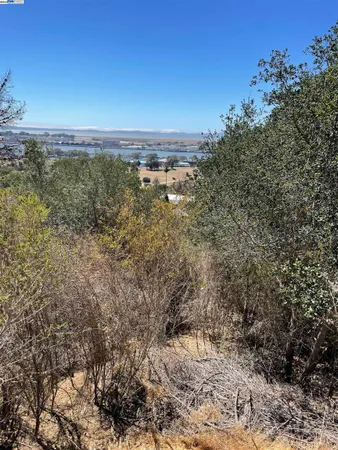a view of a field with an outdoor space