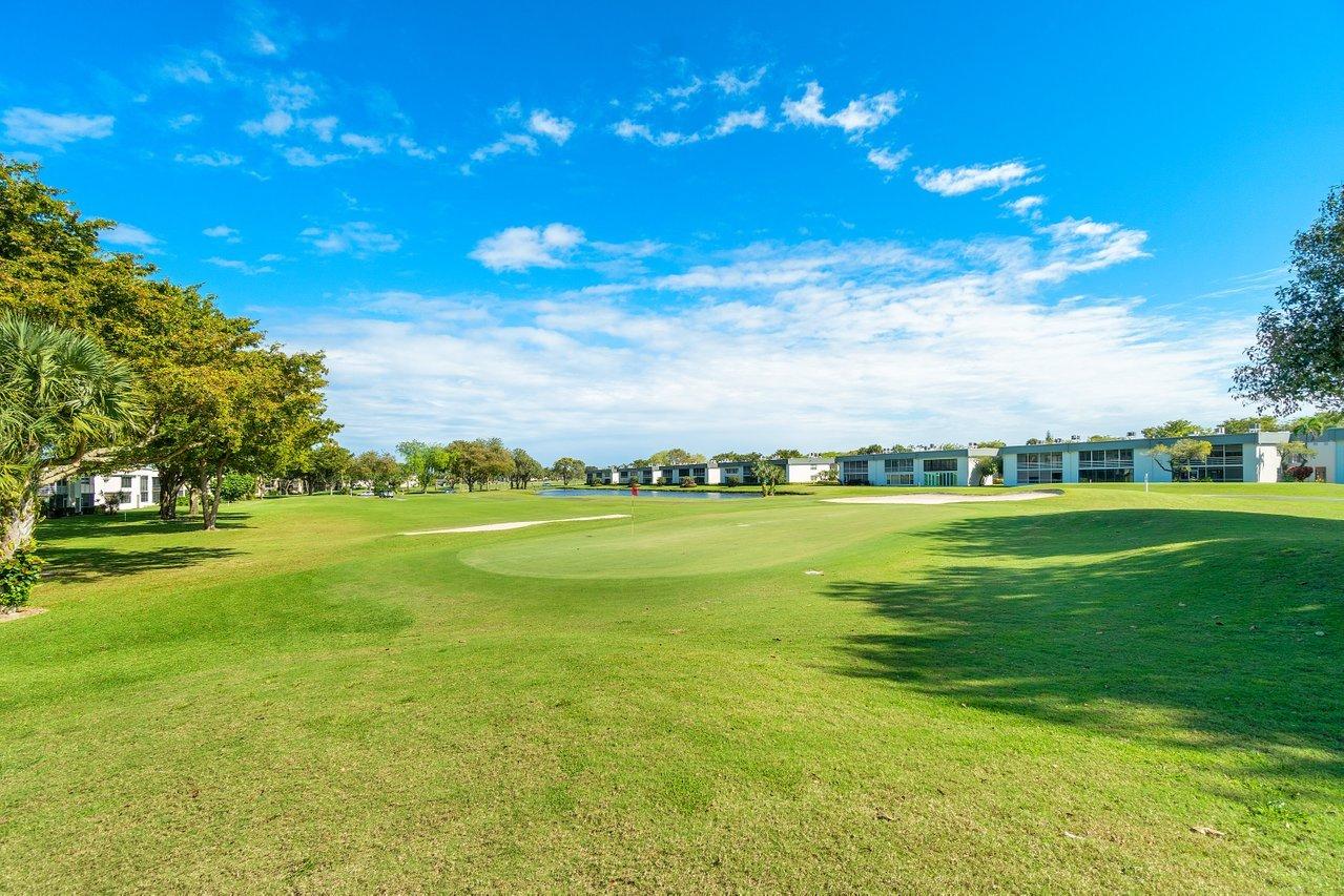 77 Normandy B Delray Beach, FL 33484 - Photo 2 of 34 a view of an ocean and houses with outdoor space