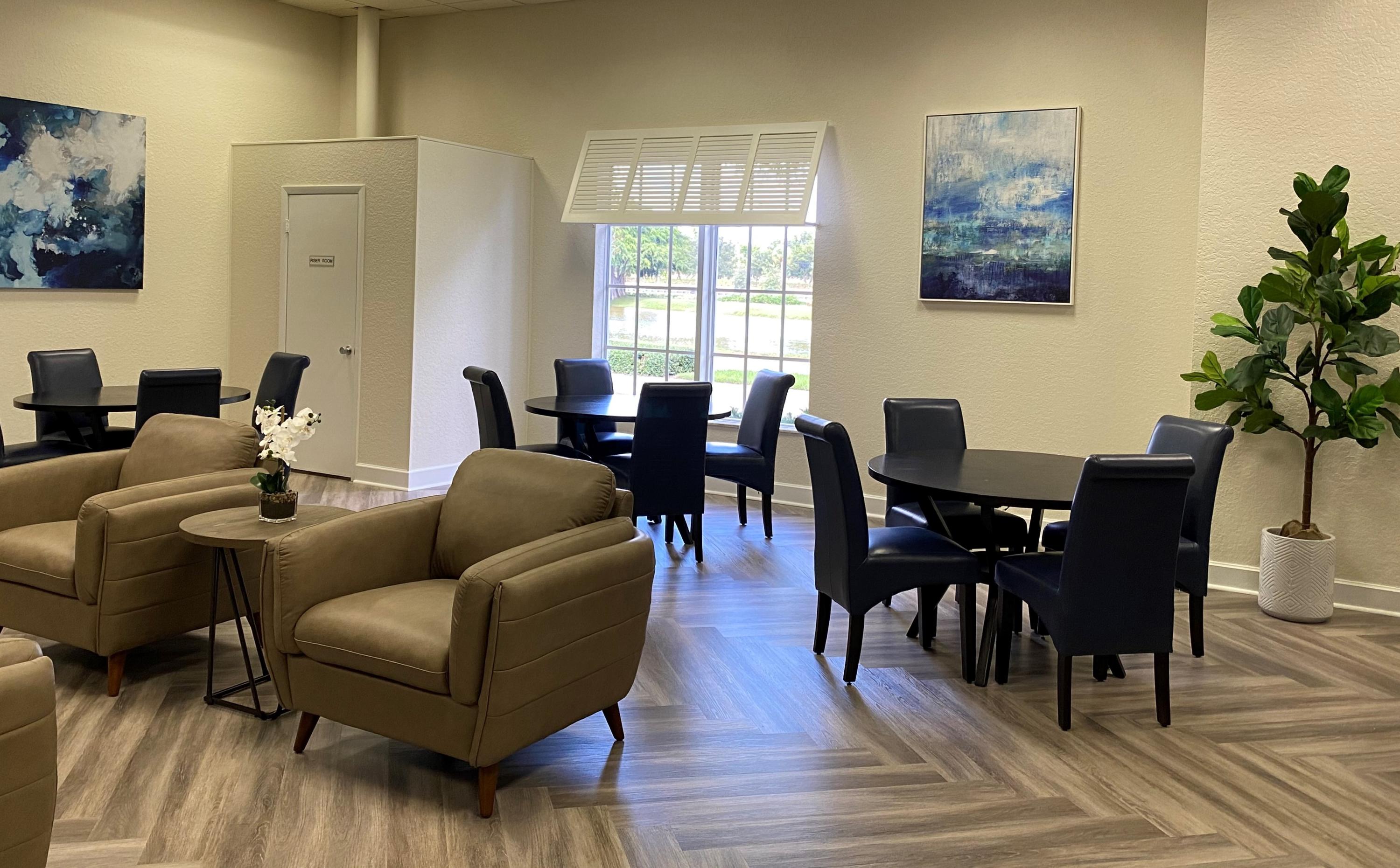 77 Normandy B Delray Beach, FL 33484 - Photo 31 of 34 a living room with furniture wooden floor and dining table