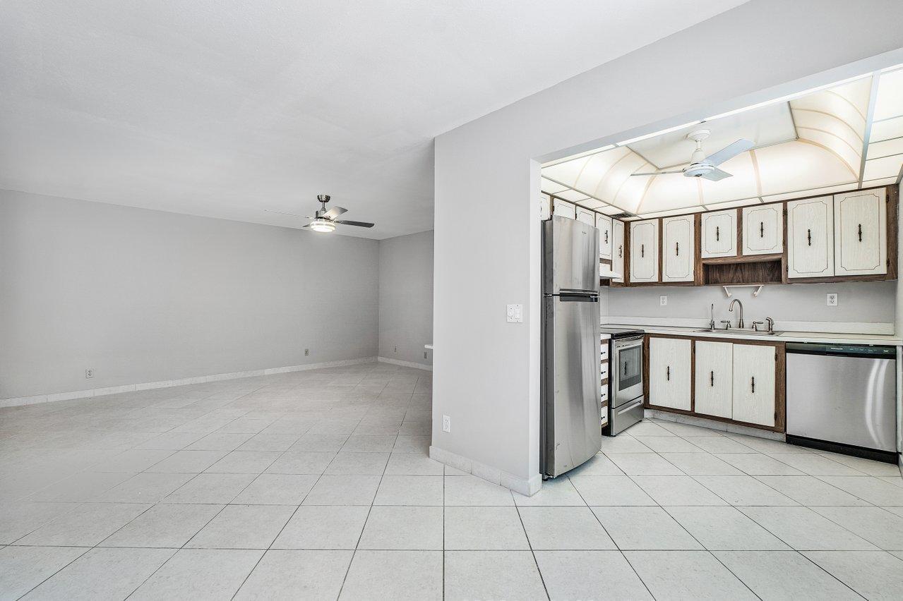 77 Normandy B Delray Beach, FL 33484 - Photo 4 of 34 a view of a kitchen with electric appliances
