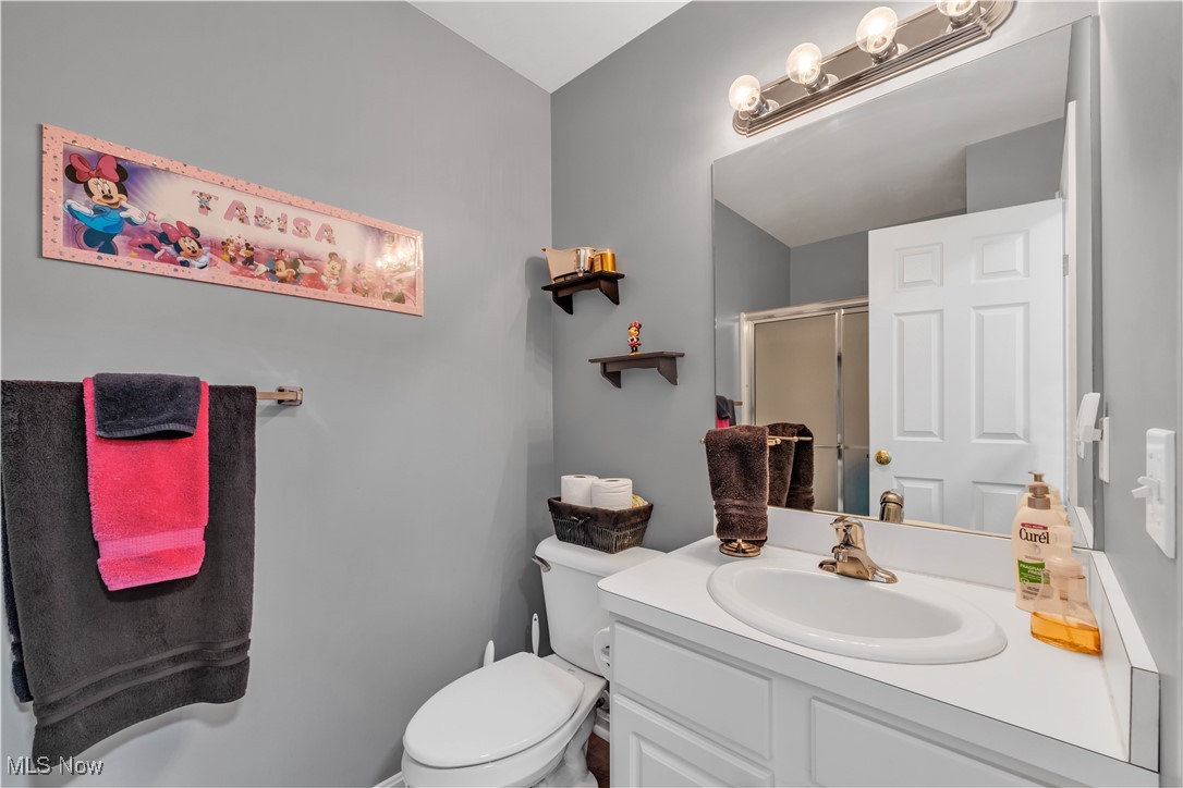 1033 Parsons Road Grafton, OH 44044 - Photo 17 of 25 Full bathroom featuring a stall shower and vanity