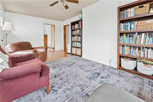 a bedroom with a bed and a book shelf