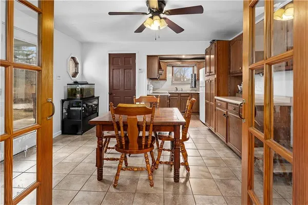 a dining room with furniture and window