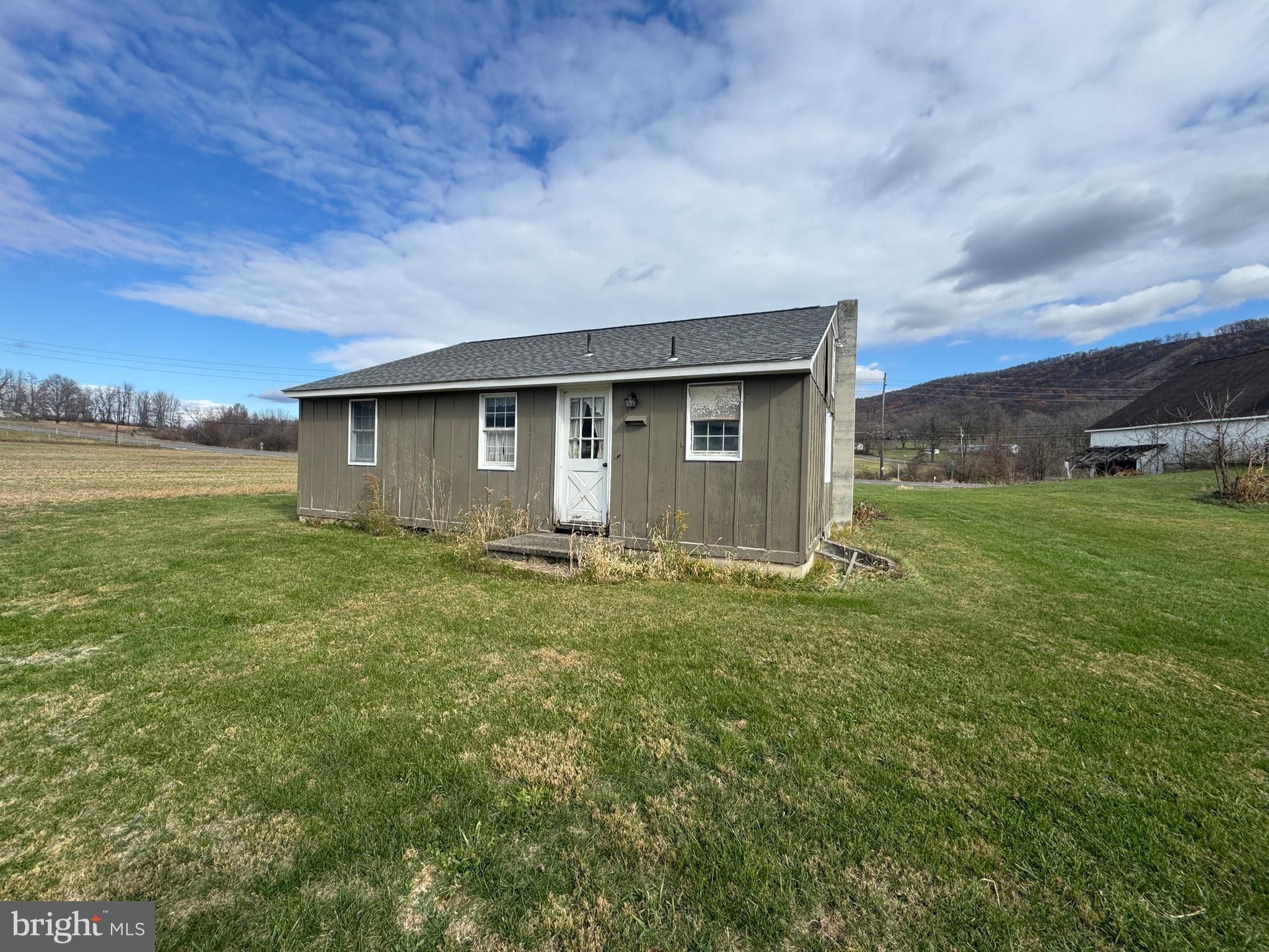 19108 Spring Run Road Spring Run, PA 17262 - Photo 13 of 24 a backyard of a house with lots of green space and mountain view in back