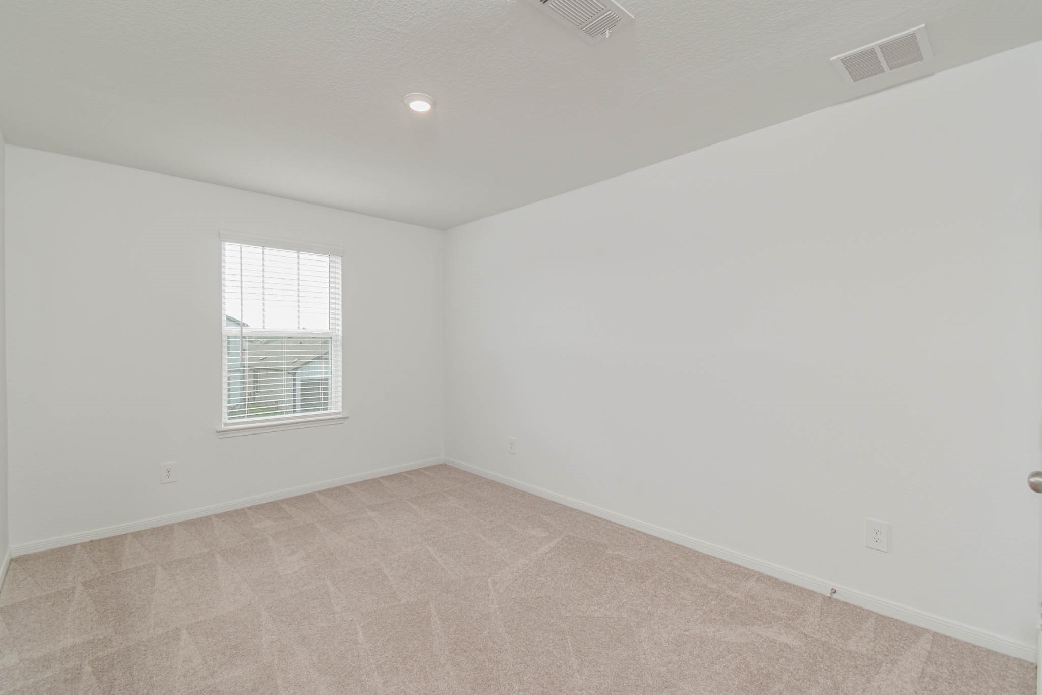 5727 Finely Run Street Spring, TX 77373 - Photo 20 of 26 an empty room with a window