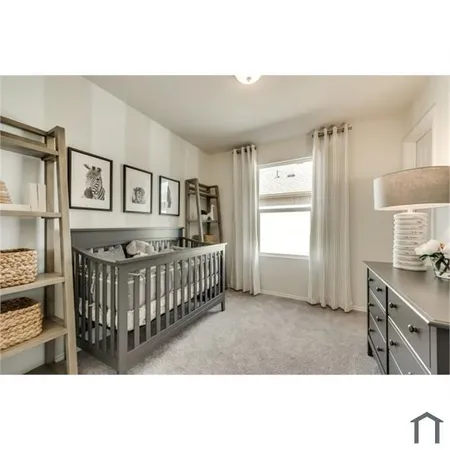 a bedroom with a bed a window and dresser