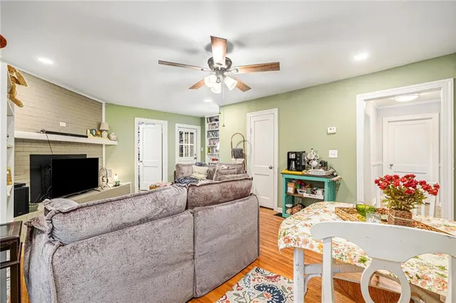 a living room with furniture fireplace and flat screen tv