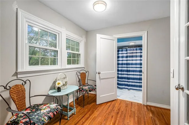 a view of a livingroom with furniture and windows