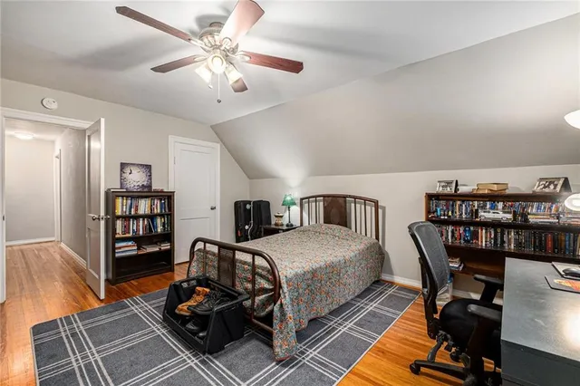 a bedroom with furniture and a chandelier