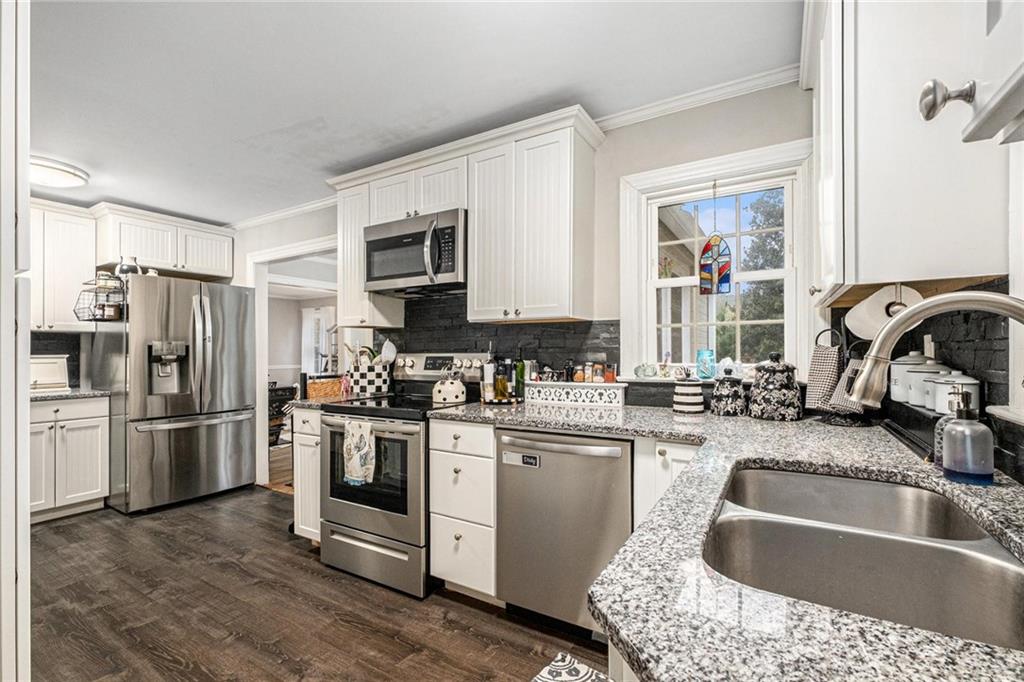 139 Myrtle Street Toccoa, GA 30577 - Photo 3 of 42 a kitchen with a refrigerator stove and sink