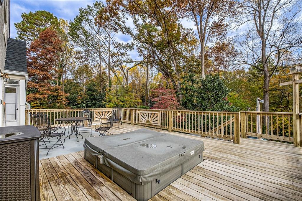139 Myrtle Street Toccoa, GA 30577 - Photo 32 of 42 a view of a wooden deck with a bench