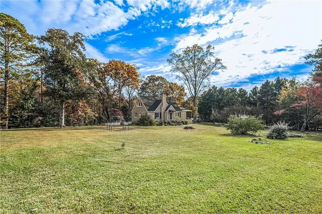 a view of a field with an trees