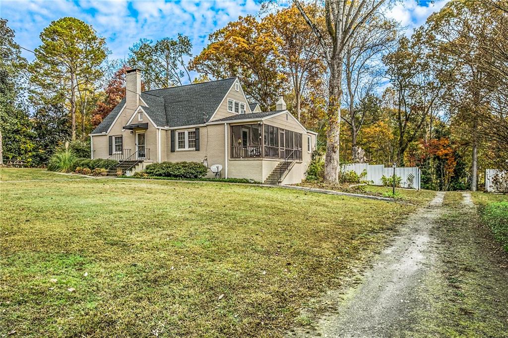 139 Myrtle Street Toccoa, GA 30577 - Photo 36 of 42 a front view of a house with a garden