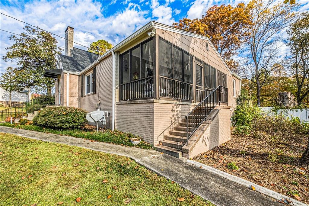139 Myrtle Street Toccoa, GA 30577 - Photo 37 of 42 a front view of a house with garden