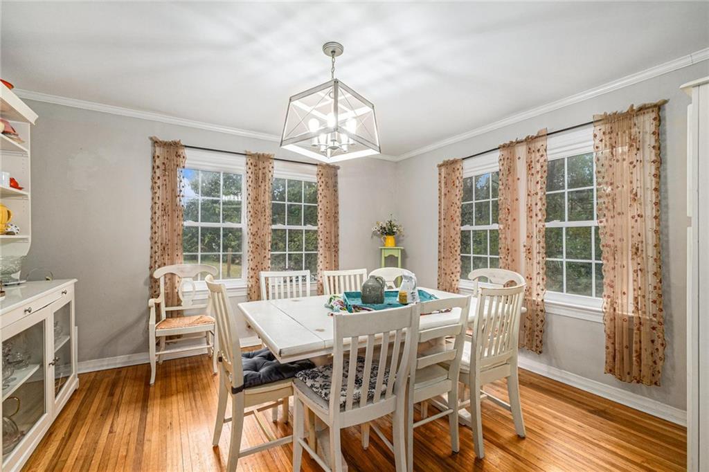 139 Myrtle Street Toccoa, GA 30577 - Photo 4 of 42 a view of a dining room with furniture wooden floor and chandelier