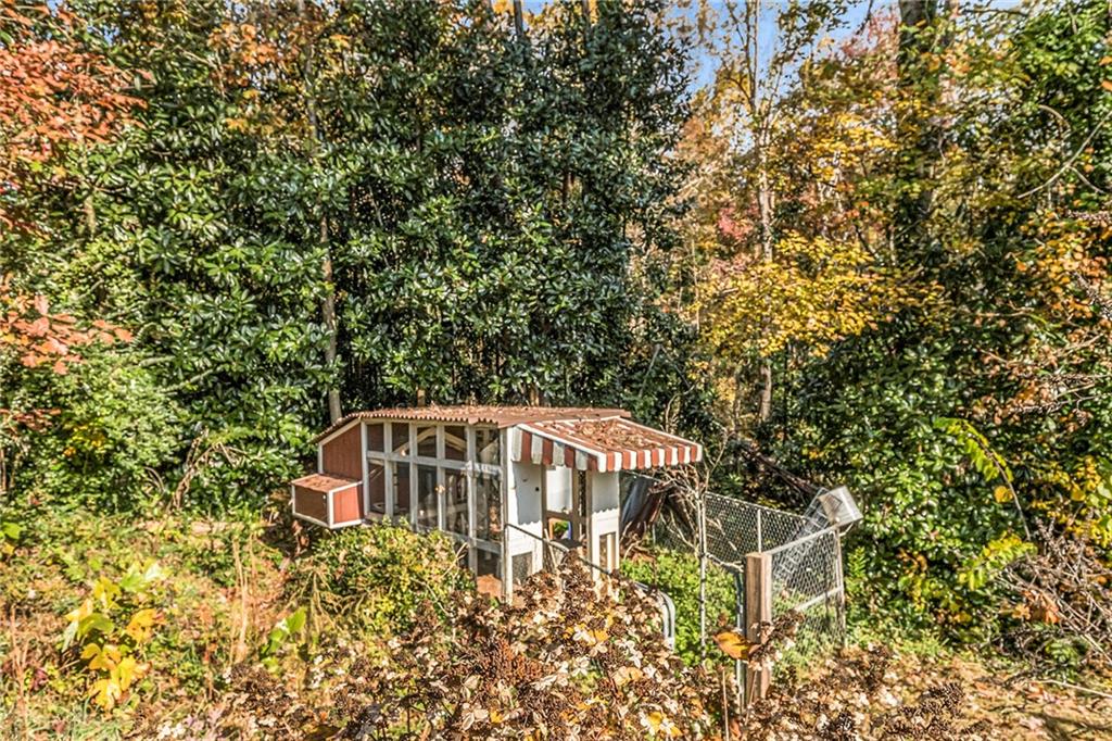 139 Myrtle Street Toccoa, GA 30577 - Photo 42 of 42 a side view of a house with a yard