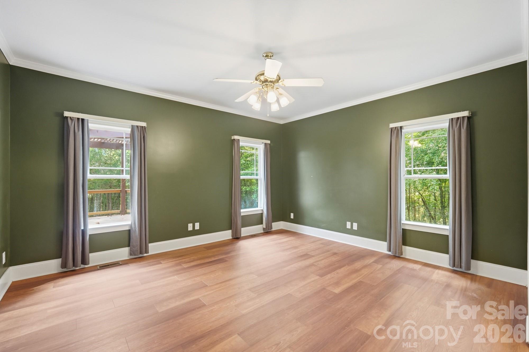 2811 Belk Mill Road Wingate, NC 28174 - Photo 19 of 36 an empty room with fan and windows
